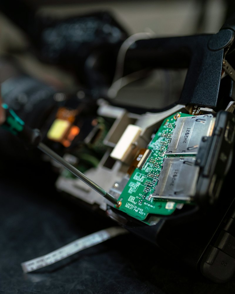 Hands repairing a circuit board